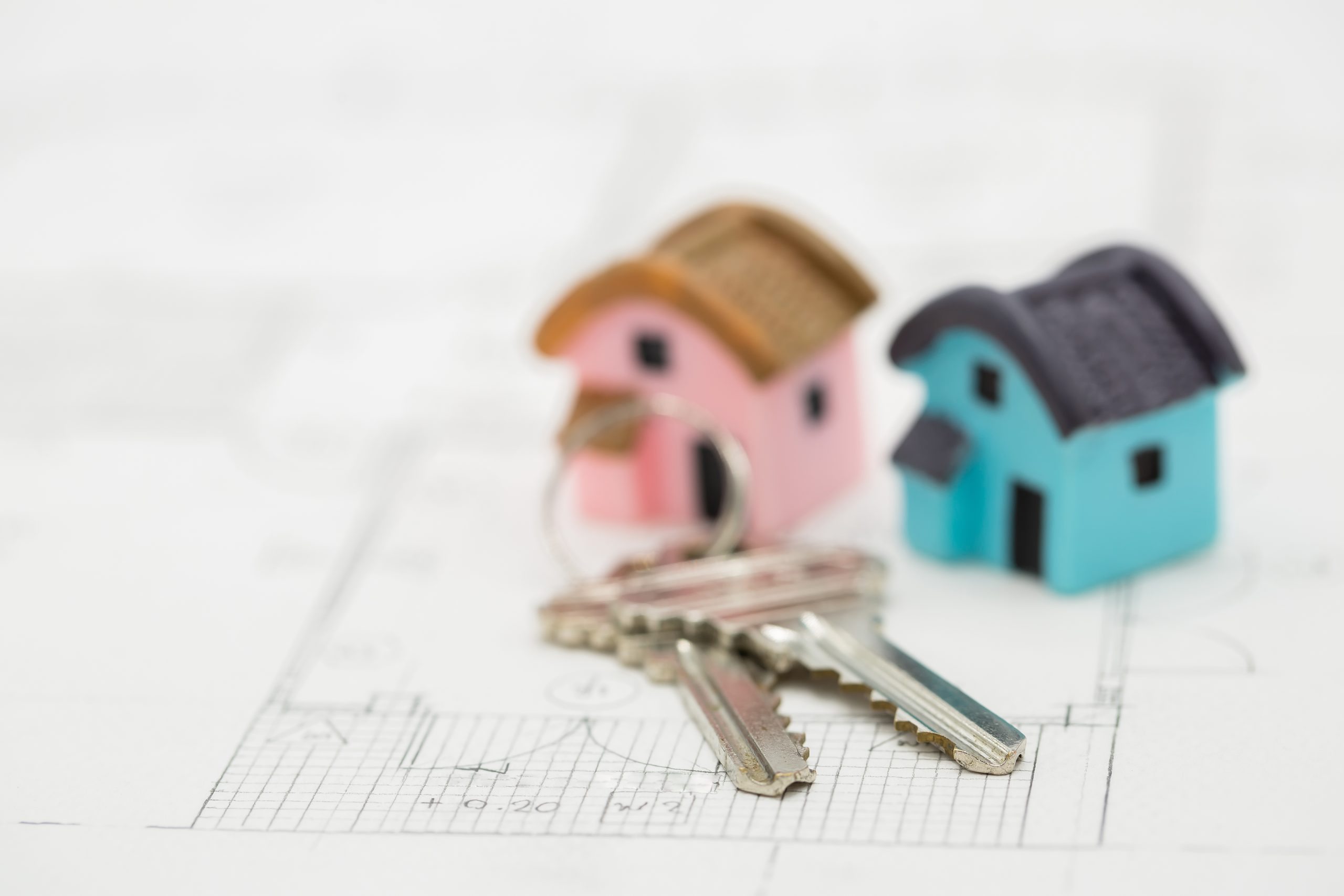 house key calculator with dollar bills